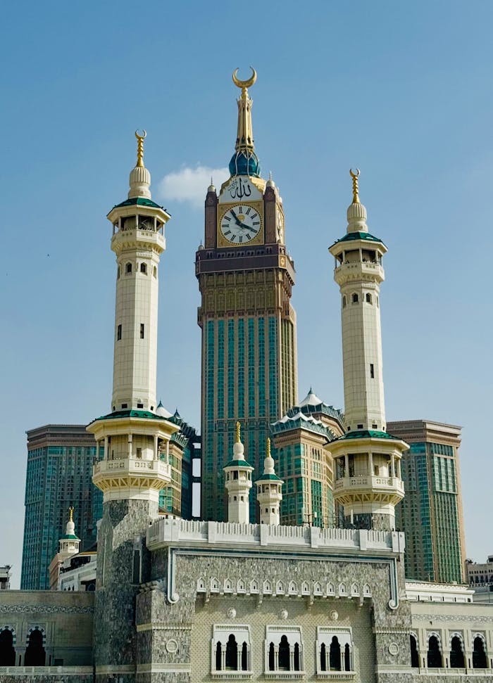Stunning architectural marvel of Abraj Al Bait Towers in Makkah, Saudi Arabia, under a clear blue sky.